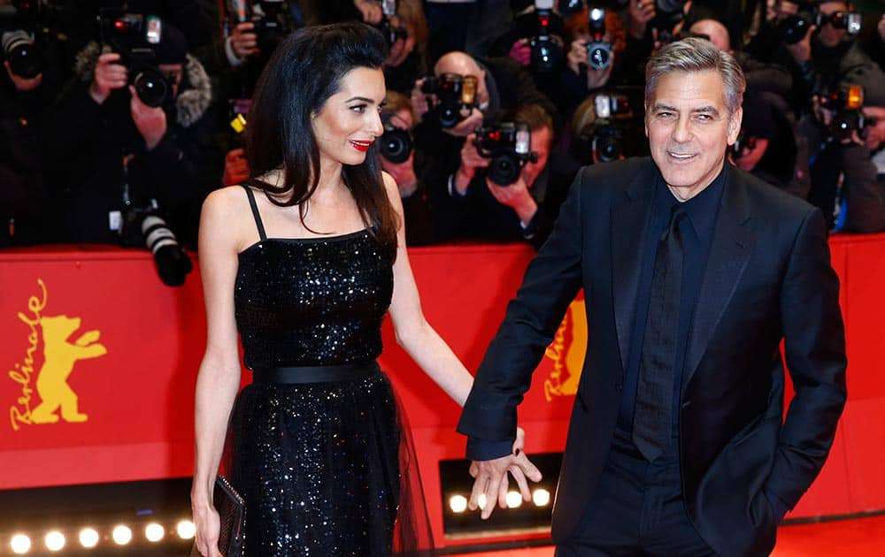 US actor George Clooney and his wife Amal Clooney arrive at the red carpet for 'Hail, Caesar!' the opening film of the 2016 Berlinale Film Festival in Berlin.