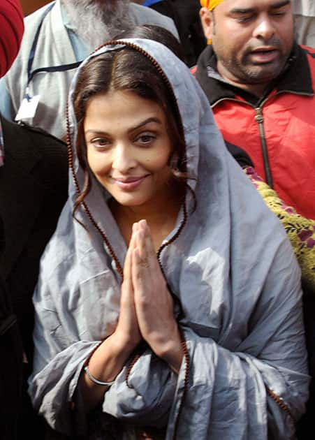 Bollywood actress Aishwarya Rai Bachchan gestures during a visit to the Golden temple in Amritsar on Friday. Aishwarya visited the city during filming for her new film Sarbjit.