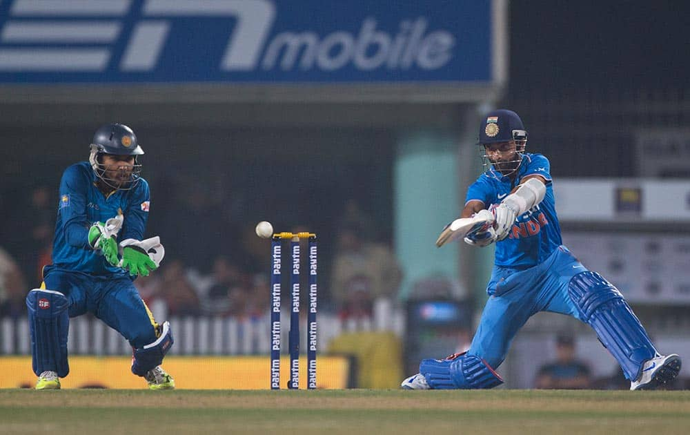 Batsman Ajinkya Rahane plays a ball against Sri Lanka during the second T20 match of a three match series between the two countries, in Ranchi.