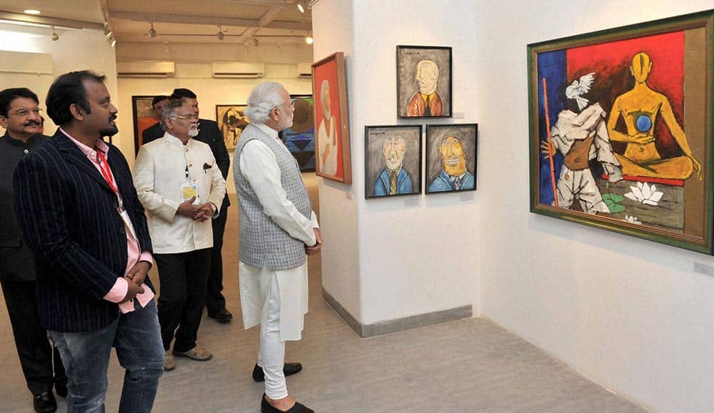 Prime Minister Narendra Modi looks on a painting after inauguration of Bombay Art Societys new building complex in Mumbai.