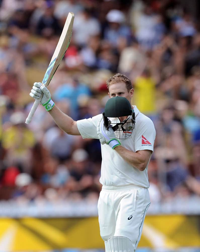 Australia’s Adam Voges kisses his helmet after reaching against double century against New Zealand on the third day of the first International Cricket Test match at Basin Reserve, Wellington, New Zealand.