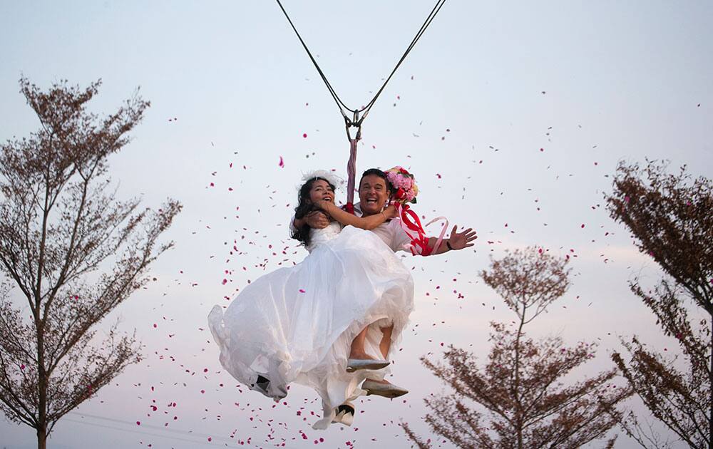 Bride Charunee Koydun? and groom British David Leslie Chesterman celebrate Valentine's Day as they take to the skies in a 