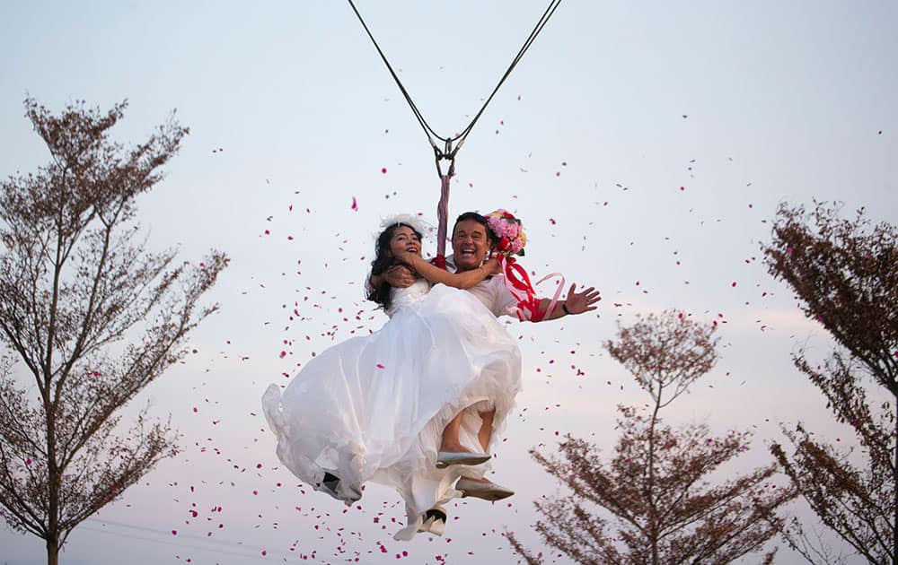 Bride Jintara Promachat and groom Kittinant Suwansiri celebrate Valentine's Day as they take to the skies in a 