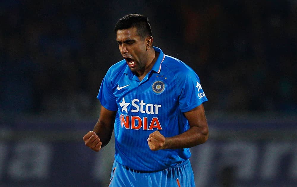 India's Ravichandran Ashwin celebrates after taking the wicket of Sri Lankan batsman Tillakaratne Dilshan, not seen, during their third Twenty20 cricket match in Vishakapatnam.