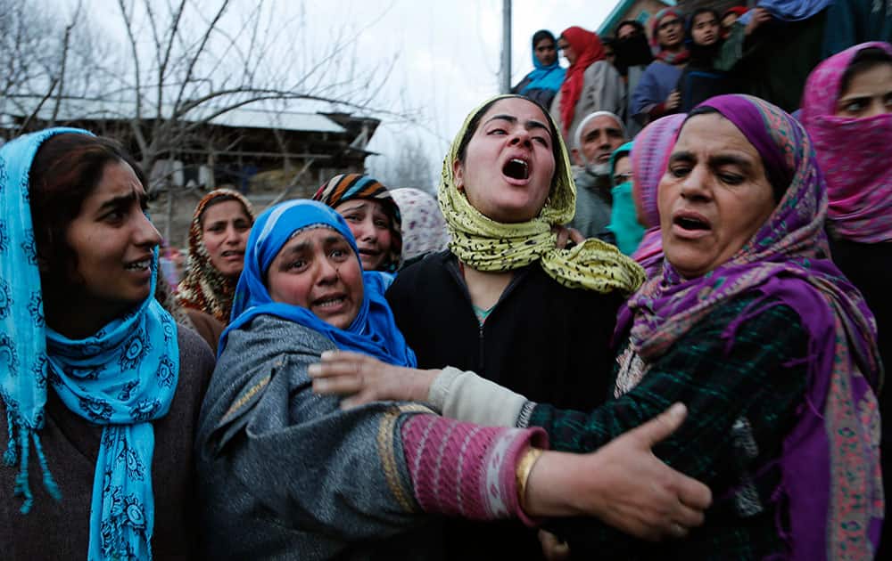 Relatives of Shaista Hamid mourn during her funeral in Lilhar south of Srinagar, India.