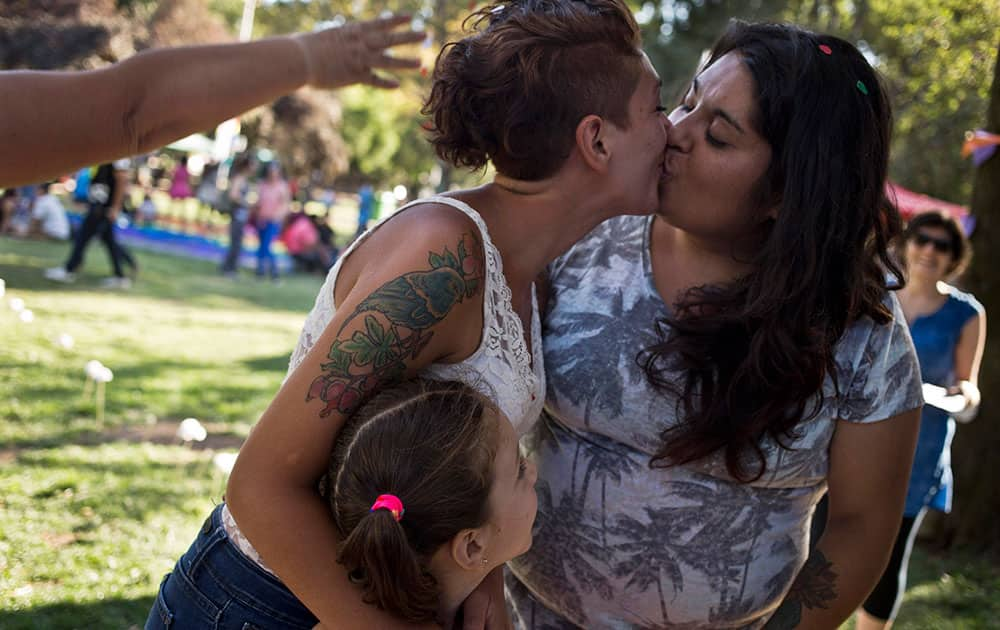 A COUPLE KISS DURING A MOCK WEDDING AS PART OF A VALENTINE'S DAY EVENT, ORGANIZED BY THE HOMOSEXUAL LIBERATION AND INTEGRATION MOVEMENT, IN SANTIAGO, CHILE.