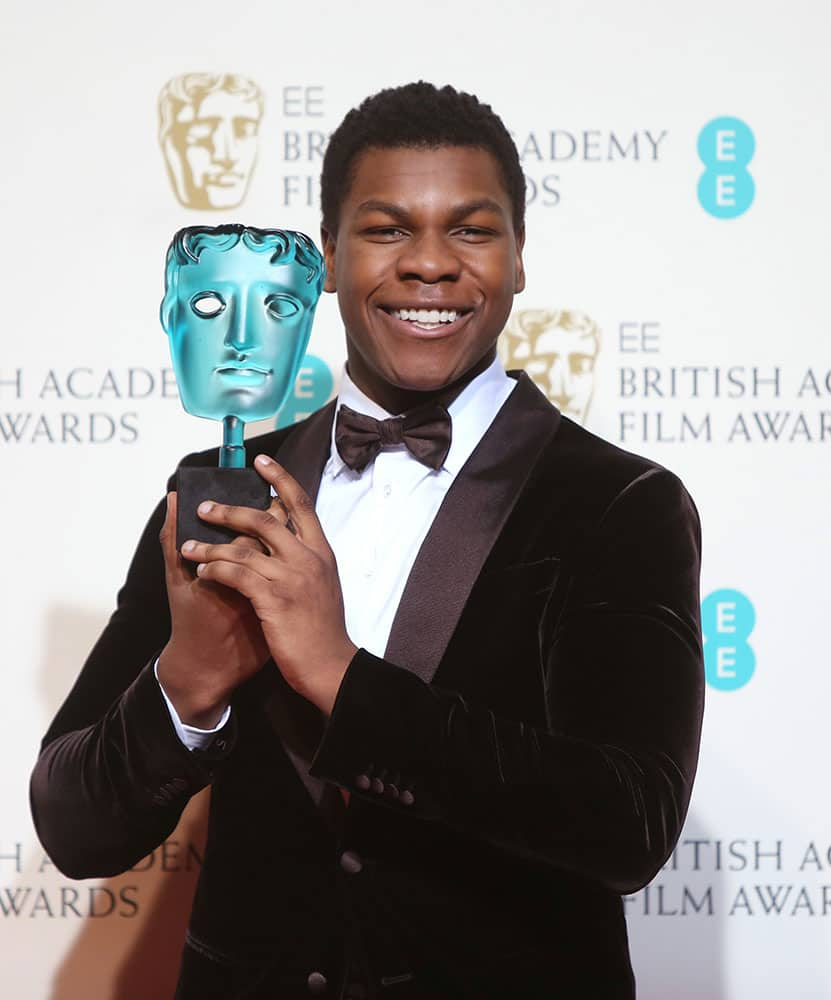 Rising Star winner John Boyega poses for photographers backstage at the BAFTA 2016 film awards at the Royal Opera House in London.