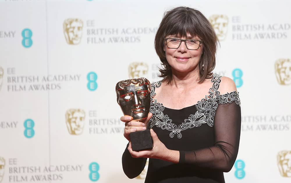 Magaret Sixel with her award for Editing for the film 'Mad Max' poses for photographers backstage at the BAFTA 2016 film awards at the Royal Opera House in London.