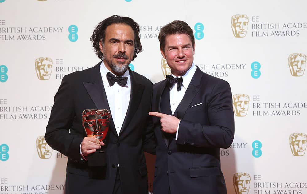 Director Alejandro Gonzalez Inarritu with the Best Film award for the film 'The Revenant' presented by actor Tom Cruise backstage at the BAFTA 2016 film awards at the Royal Opera House in London.