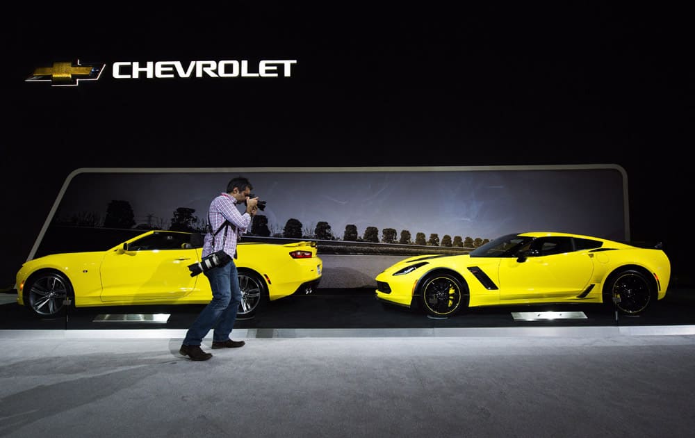 A man photographs a Chevy Corvette at the 2016 Canadian International Autoshowin Toronto on Thursday, Feb. 11, 2016. 