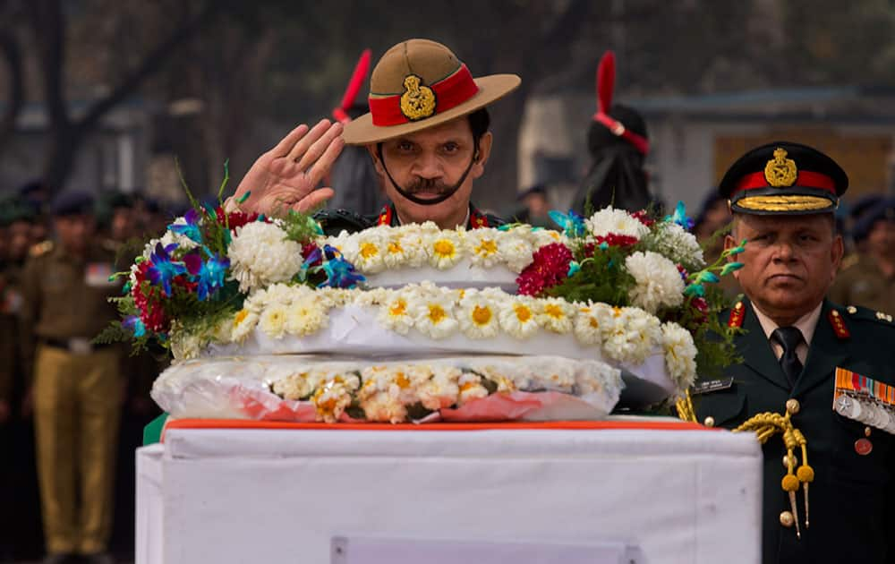 Indian Chief of Army Staff, Dalbir Singh Suhag pays respects to Indian soldiers who died in an avalanche that struck their post on the world's highest battlefield in Siachen Glacier, at a ceremony in New Delhi.