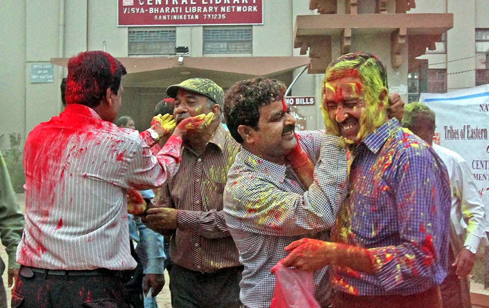 Staff of Visva-Bharati University plays with colours after President Pranab Mukherjee approved the sacking of Vice-Chancellor Sushanta Dattagupta at Santiniketan in Birbhum district of West Bengal.