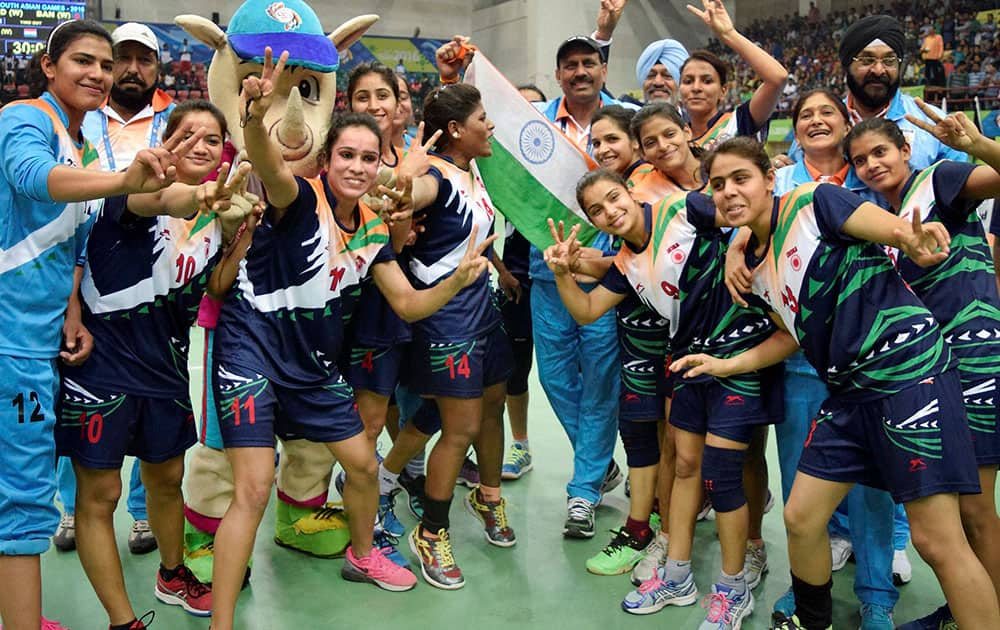 Indian womens handball team celebrates after winning the final match against Bangladesh at the 12th South Asian Games in Guwahati.