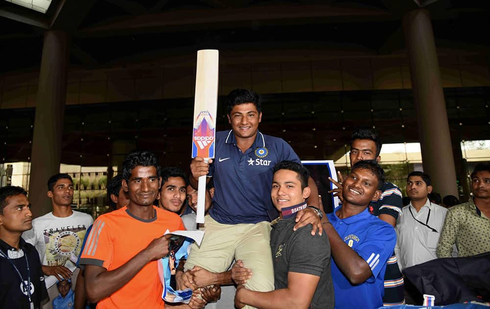 Players of the under-19 Indian cricket team arrive at the international airport in Mumbai on Monday. The team won the runners trophy in the U-19 World Cup in Dhaka. 