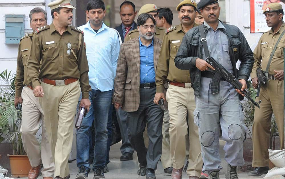 Former Delhi University professor SAR Geelani being taken to Patiala House Courts from Parliament Street Police Station in New Delhi.