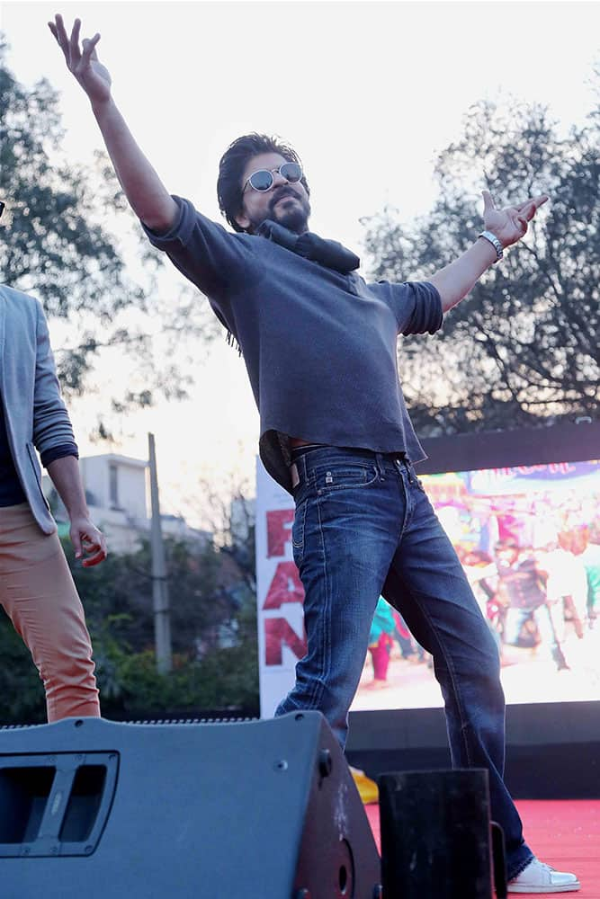 Actor Shahrukh Khan strikes a pose at the launch of his new film song at Hansraj College in New Delhi.