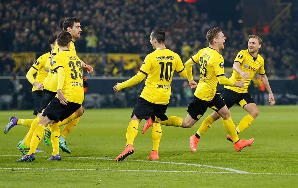 Dortmund's Lukasz Piszczek, celebrates his side's opening goal during a Europa League round of 32 first leg soccer match between Borussia Dortmund and FC Porto the Signal Iduna Park stadium in Dortmund, Germany.