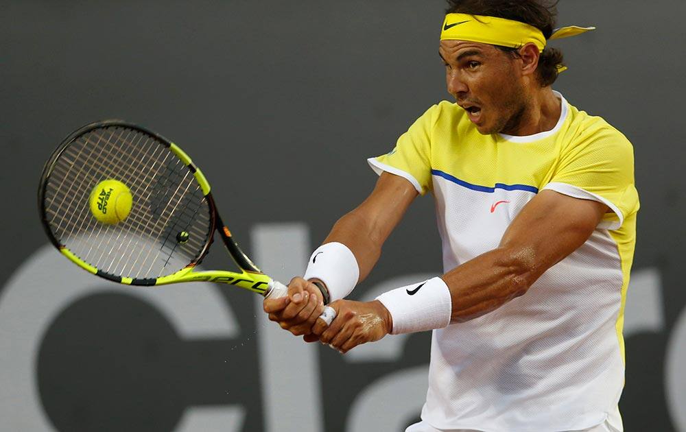 Rafael Nadal of Spain returns the ball to Nicolas Almagro of Spain, during a Rio Open tennis match, in Rio de Janeiro, Brazil.