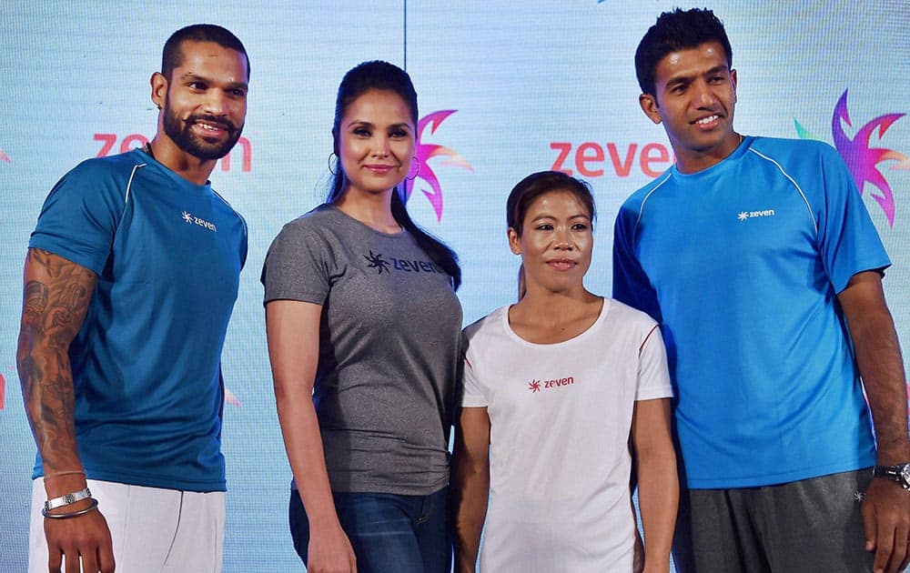 Cricketer Sikhar Dhawan, actress Lara Dutta, boxing star Mary Kom and tennis star Rohan Bopanna pose for photographs during the launch of Zeven sports brand in New Delhi.