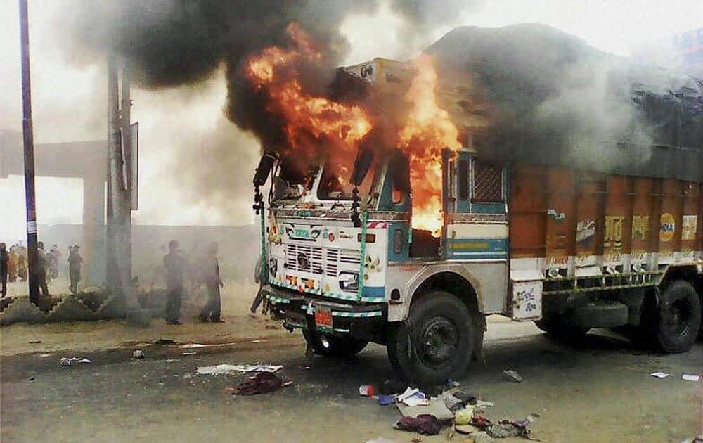 Irate mob torch a truck after it mowed down three school girls in Sambhal.