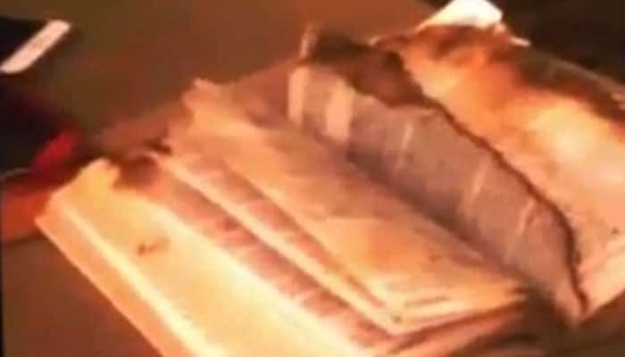 Scary moment! Ghost turning pages of a scorched bible – watch video