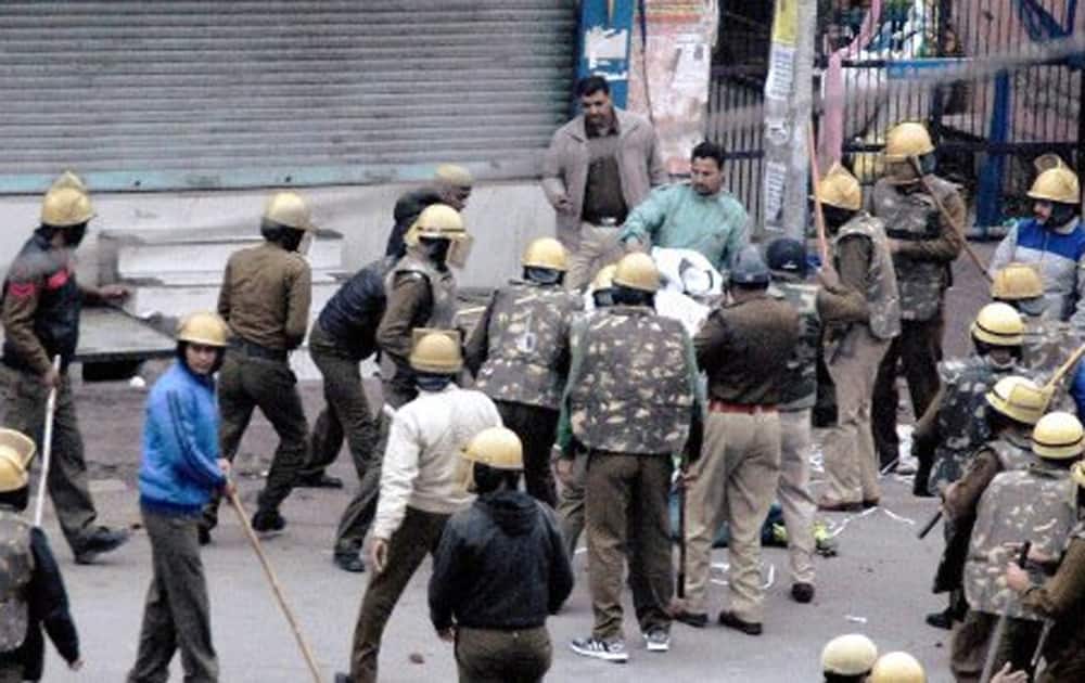 Police lathicharge Jat community members during their agitation for reservation in Rohtak.
