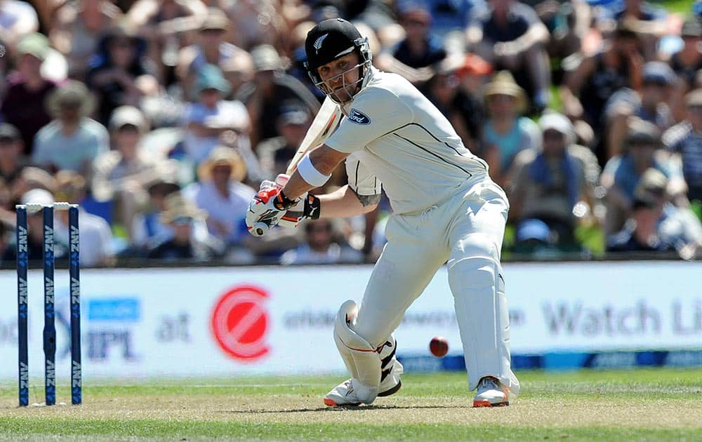 New Zealand’s Brendon McCullum comes down the wicket to Australia’s Mitchell Marsh's bowling on the first day of the second International Cricket Test match at Hagley Park Oval in Christchurch, New Zealand.