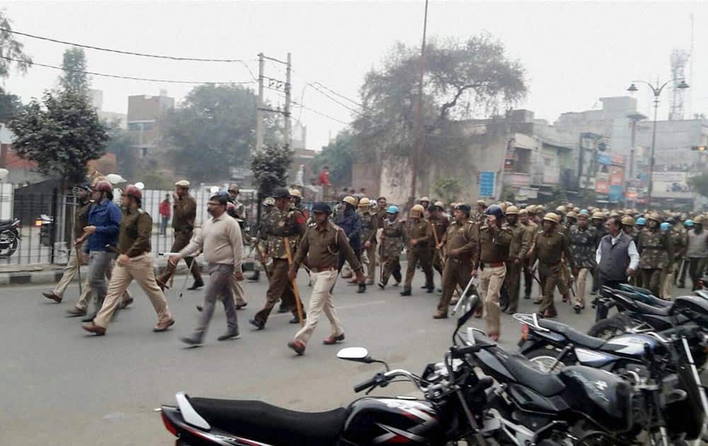 Security forces personnel patrol a street in the view of incidents of violence due to Jat agitation for reservation, in Rohtak.