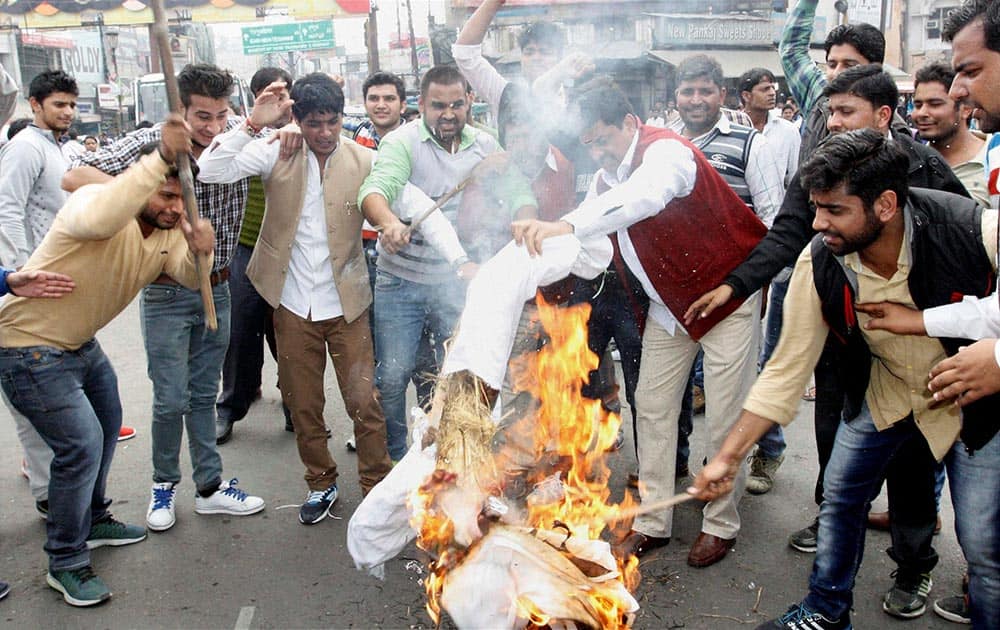 Protestors demanding reservation for Jats in government jobs burn an effigy of Haryana Chief Minister Manohar Lal Khattar in Meerut.