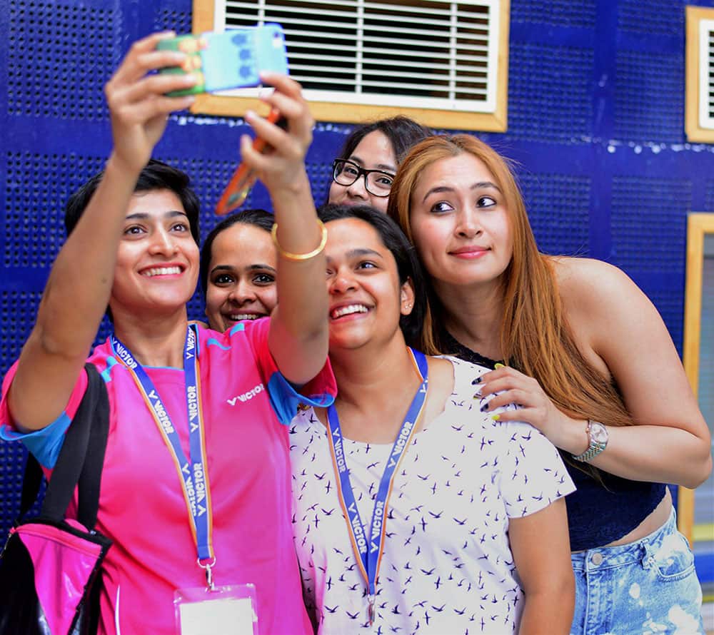 India`s Jwala Gutta and Ashwini Ponnappa taking selfie with fans at the Badminton Asia Team Championships in Hyderabad.