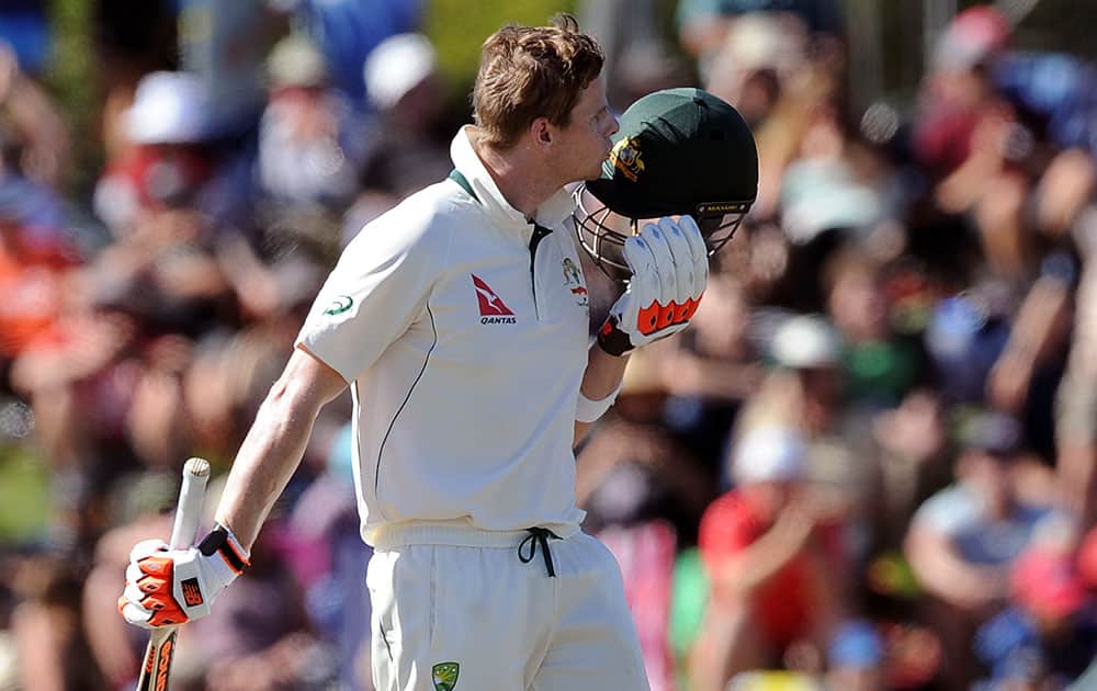 Australia’s Steve Smith kisses his helmet after reaching a century against New Zealand on the second day of the second International Cricket Test match at Hagley Park Oval, in Christchurch, New Zealand.