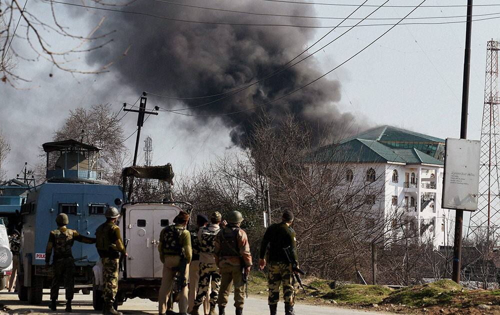 Smoke billowing out of the JKEDI building where militants have reportedly taken refuge after launching an attack on a CRPF convoy at Sampora Pampore, near Srinagar.