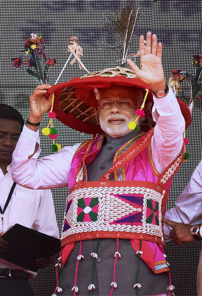 Prime Minister Narendra Modi in a traditional attire at the launch of Shyama Prasad Mukherji National Rurban Mission, at Kurubhat in Rajnandgaon district in Chhattisgarh.