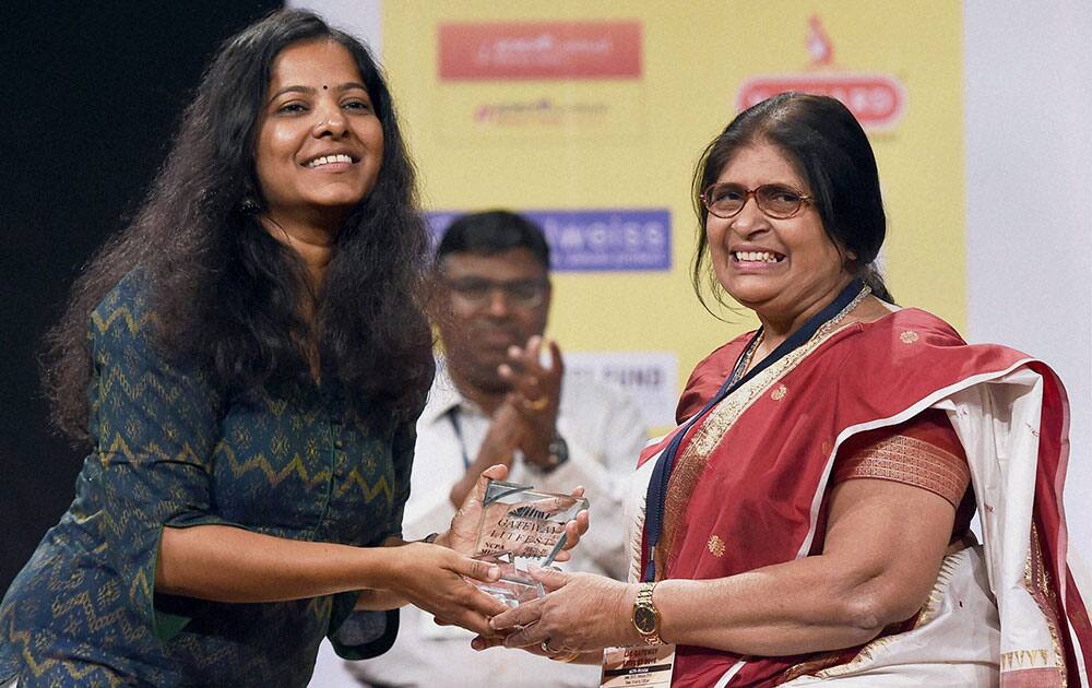 Tamil Filmmaker, Poet and actor, Leena Manimekalai (L) felicitates Sahitya Academy award winner and writer Shefalika Verma at the LIC Gateway Litfest 2016 literature festival, in Mumbai.