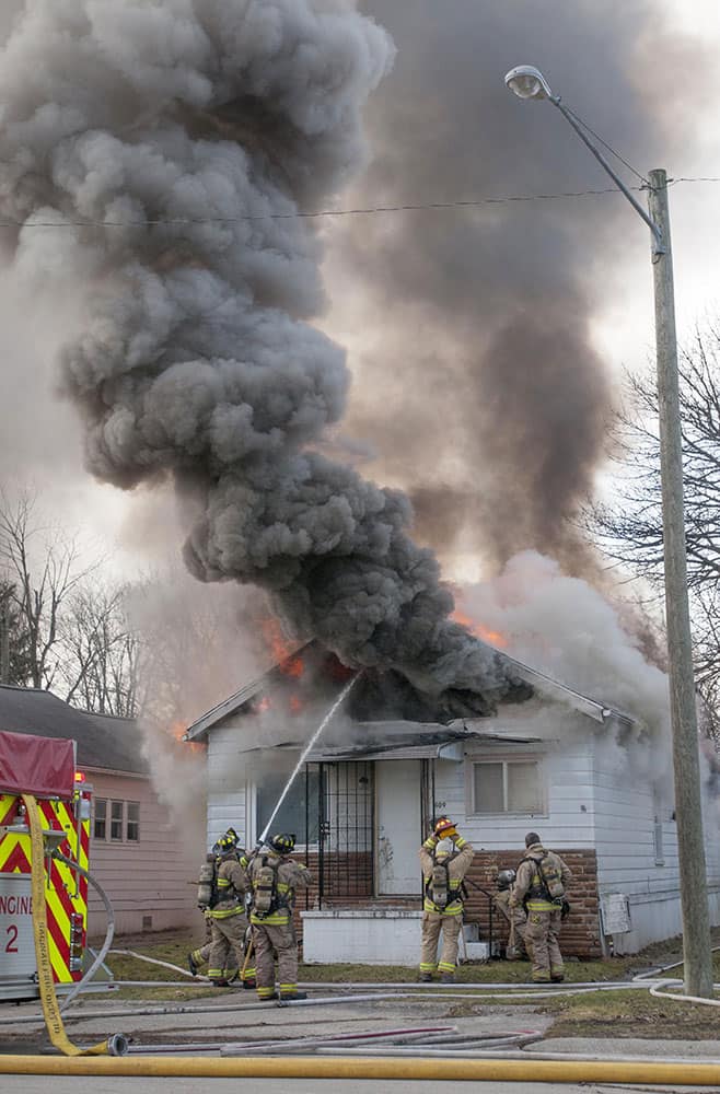 Saginaw : Firefighters work to extinguish a fire.