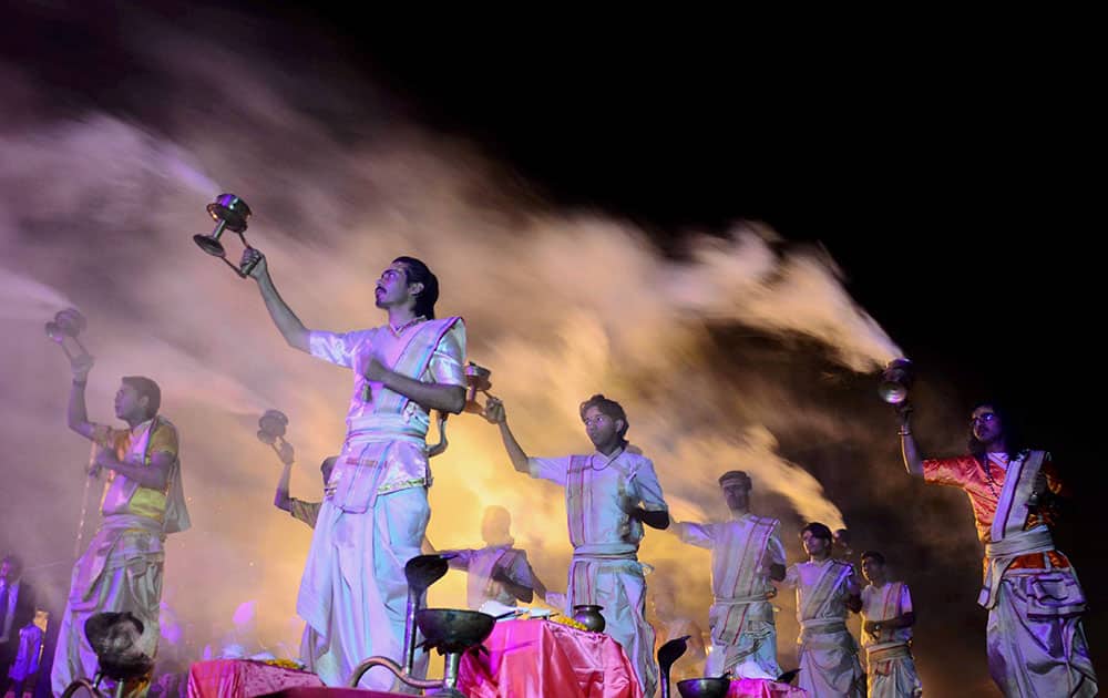 Priest performing Ganga Aarti on the occasion of 1st day of Triveni Mahotsav at bank of Yamuna in Allahabad.
