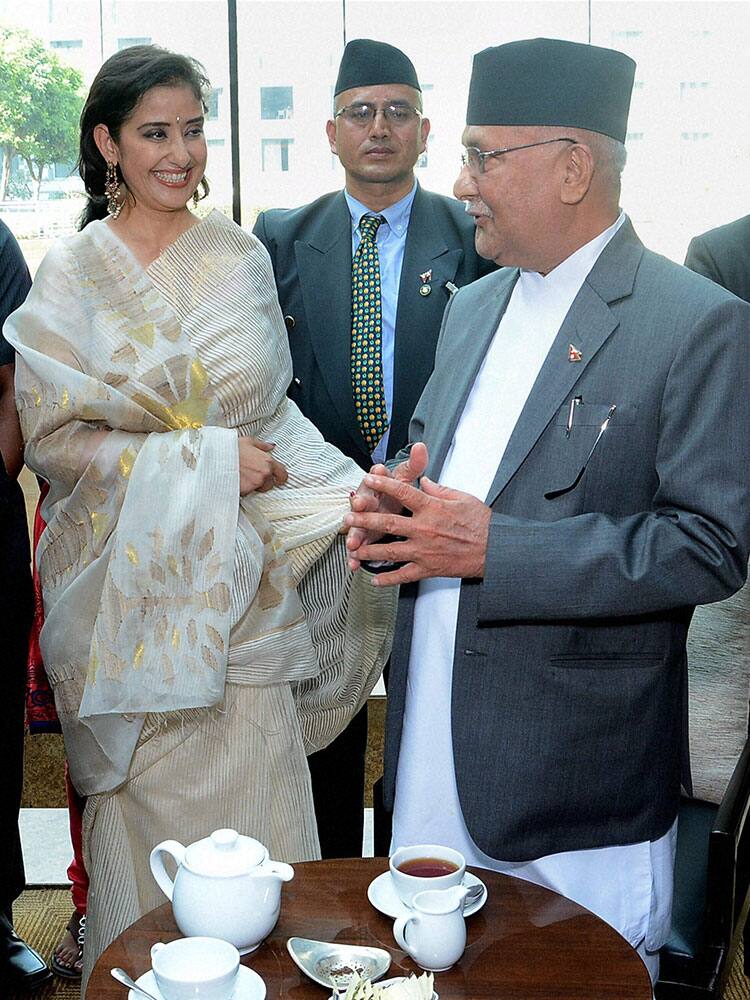 Prime Minister of Nepal K P Sharma Oli with Bollywood actress Manisha Koirala at a meeting over a high tea in Mumbai.