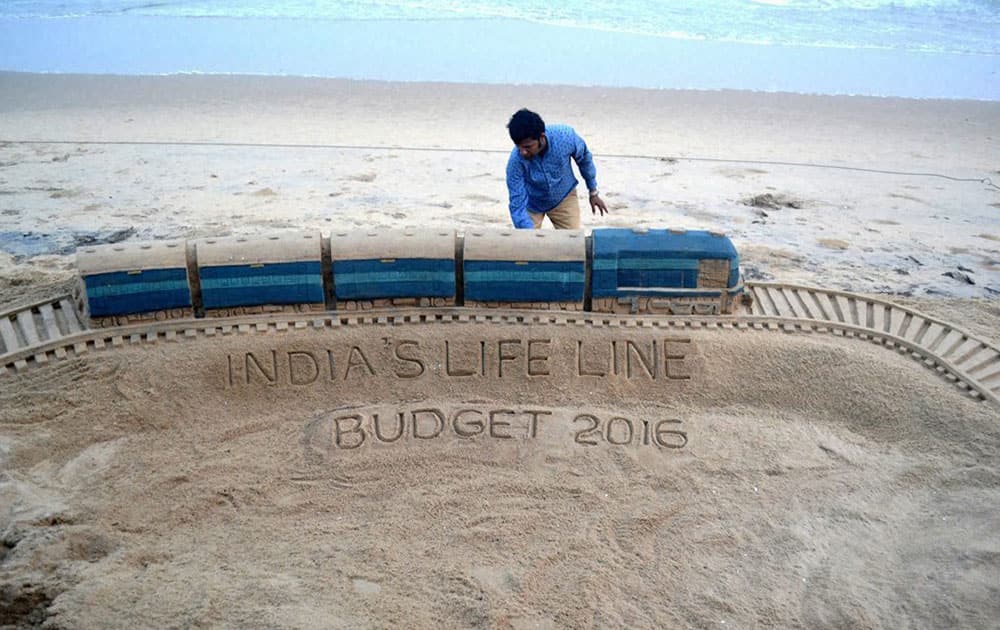 Sand artist Sudarsan Pattnaik created a sculpture on on Rail budget 2016 with message Indias life line at Puri beach of Odisha.