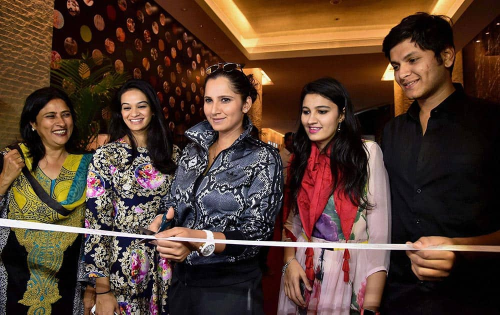 Tennis star Sania Mirza inaugurates an exhibtion of designer clothes in Hyderabad.