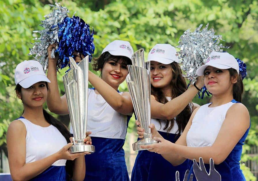 Models cheerup with ICC T20 World Cup Trophy during an event for its public viewing in Nagpur, Maharashtra.