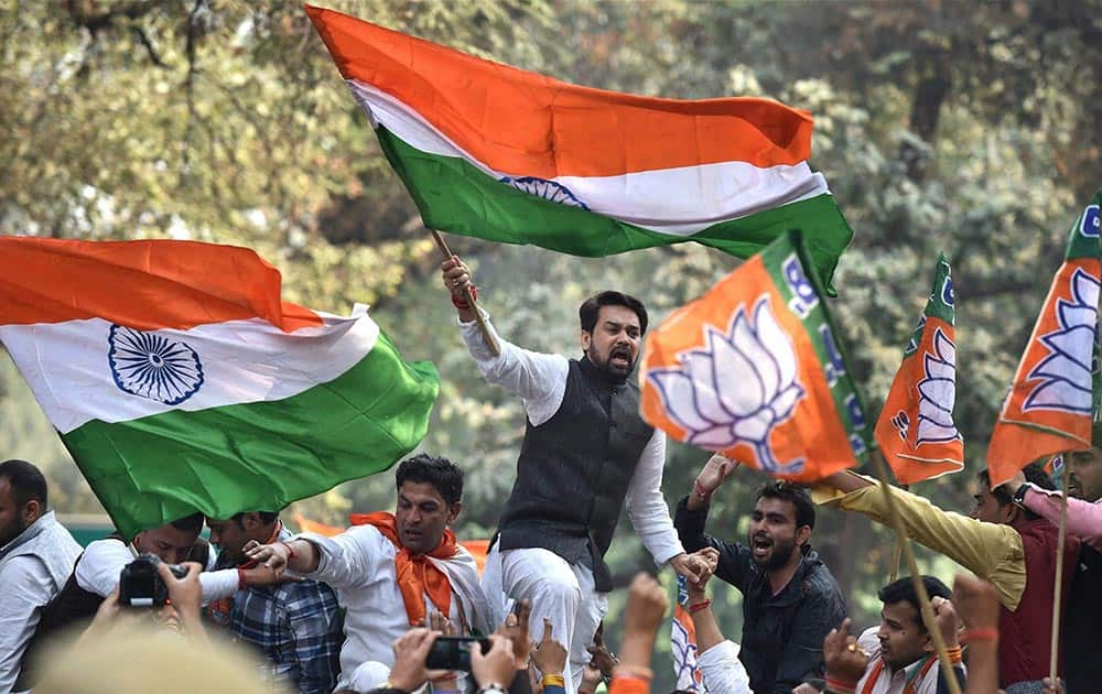 BJPs youth wing chief and MP Anurag Thakur (C) during a protest at 24 Akbar Road (AICC), demanding a clarification from Congress leadership on their stand on Parliament attack convict Afzal Guru, in New Delhi.