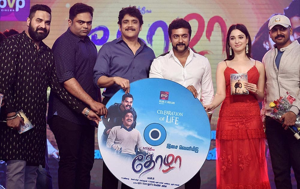 Actors Akkineni Nagarjuna, Karthi, Suriya, Tamannaah and others during the audio launch of their upcoming movie Thozha in Chennai.