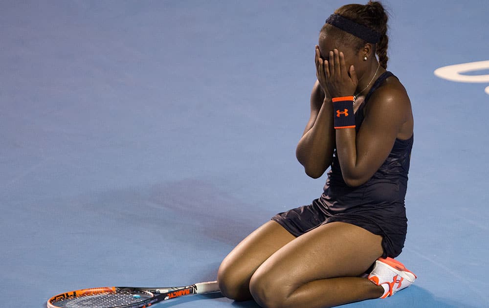 Sloane Stephens, of the United States, covers her face after defeating Dominika Cibulkova, of Slovakia, during the WTA final of the Mexican Tennis Open in Acapulco, Mexico.