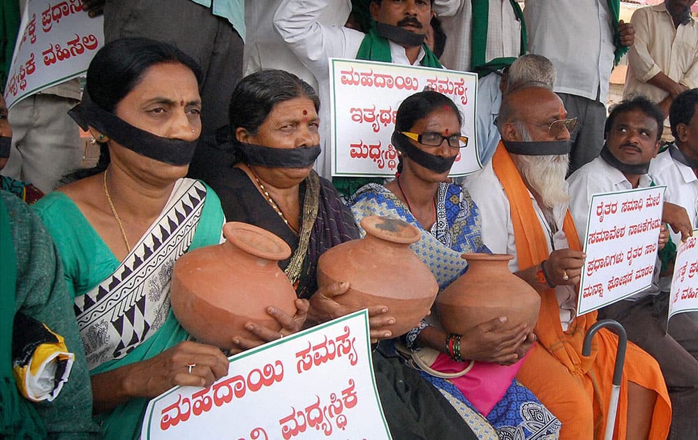 People holding a rally demanding implementation of Kalasa Bandoori Nala Drinking Water project, in Hubli.