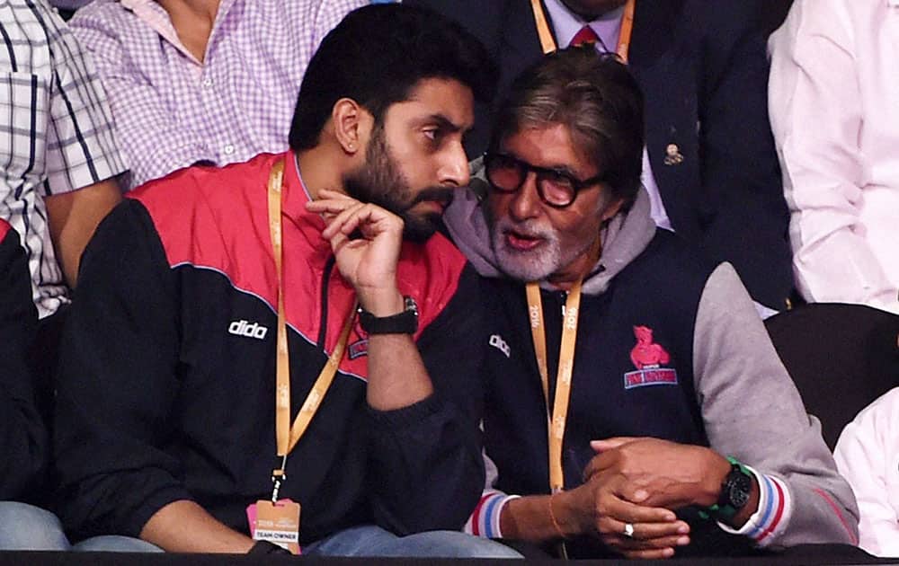 Jaipur Pink Panthares team owner Abhishek Bachchan with father Amitabh Bachchan during the Pro Kabaddi match played against U Mumbai.