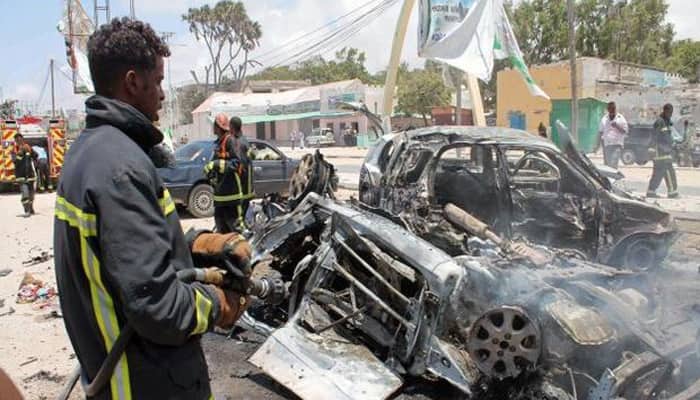 Islamist group kills 30 in twin blasts in Somali town