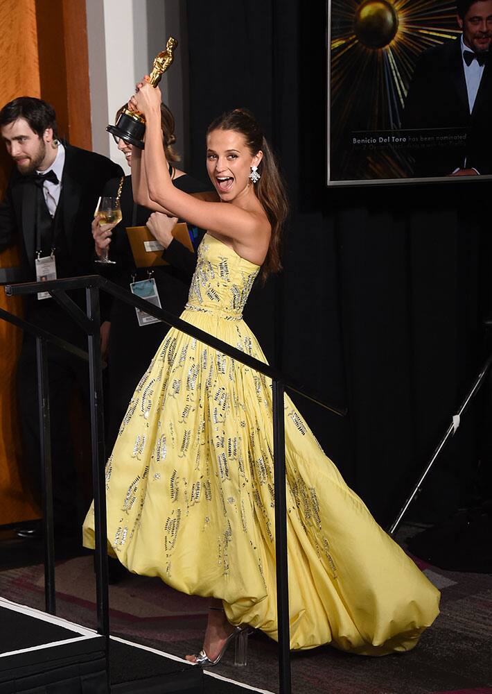 Alicia Vikander poses with the award for best actress in a supporting role for “The Danish Girl” in the press room at the Oscars at the Dolby Theatre in Los Angeles.