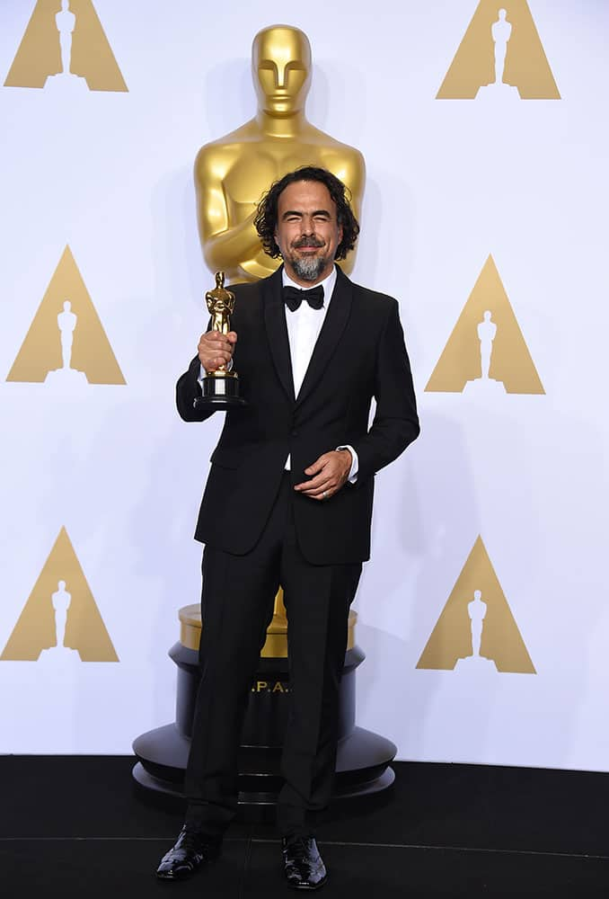 Alejandro G. Inarritu poses in the press room with the award for best director for “The Revenant” at the Oscars at the Dolby Theatre in Los Angeles.