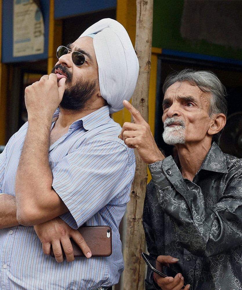 Investors reacts to stock prices at the BSE as the sensex declines on the union budget announcements, in Mumbai.