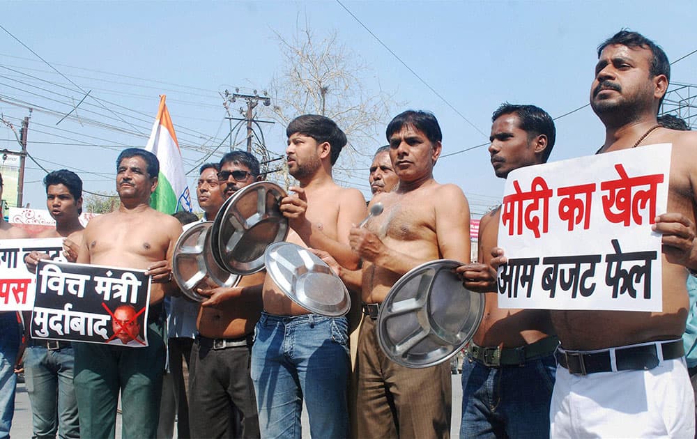 Congress party workers holding a semi-nude protest against Union Budget in Allahabad.